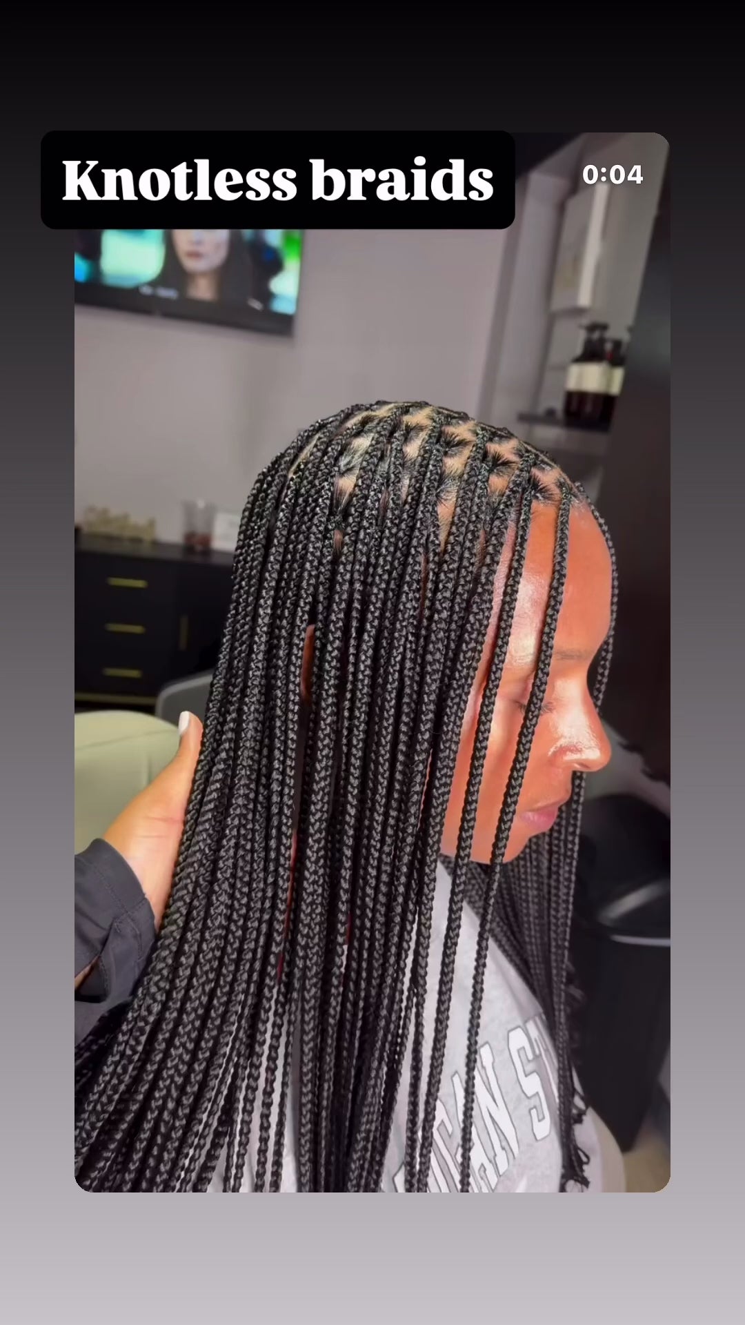small sized mid back length knotless braids in black colour 
