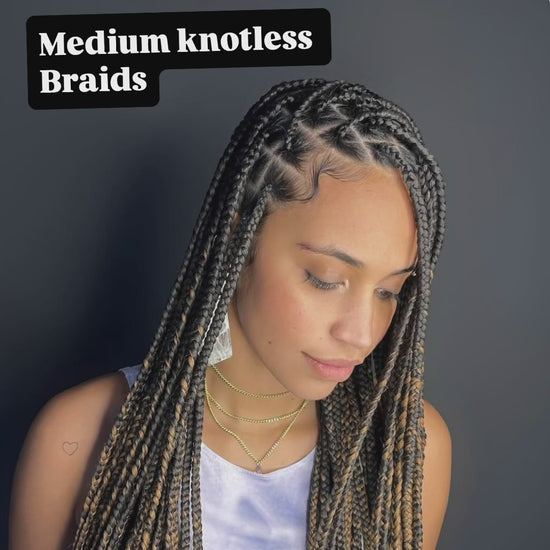 knotless braids in black and blonde colour. waist length