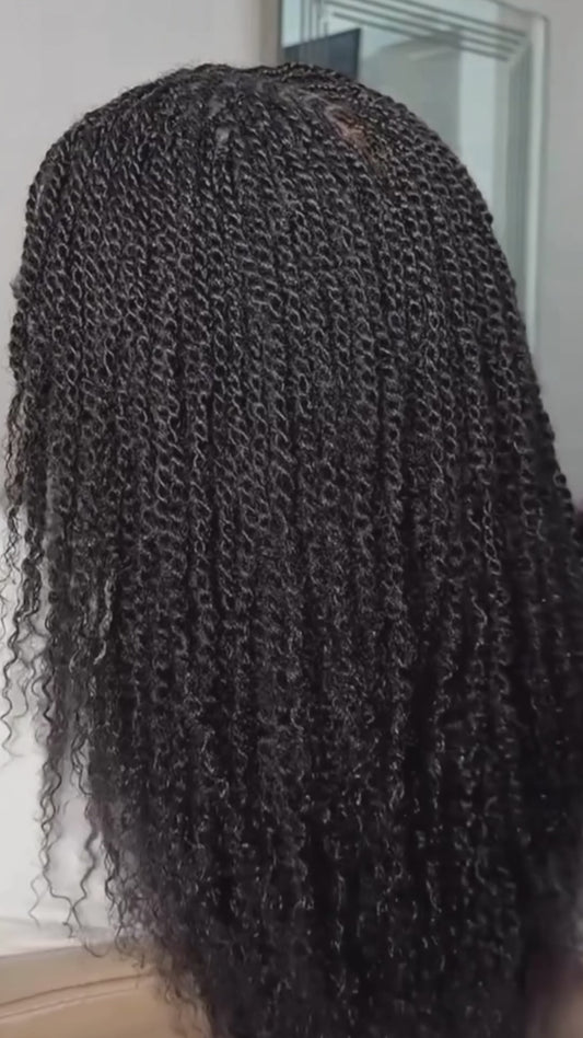 human hair kinky twists being displayed from the back of a woman 