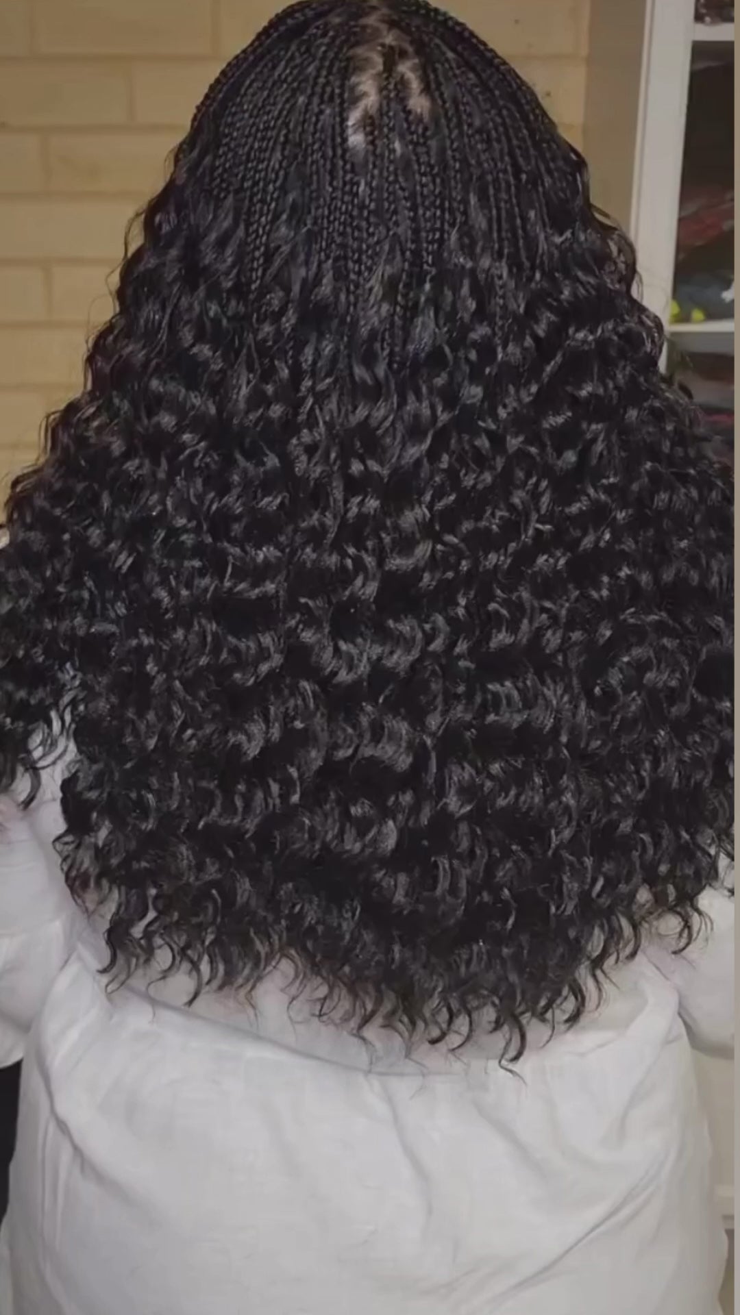 lady showing off her curly pick and drop from the back. She used crown royale hair braiding bundles in deep wave