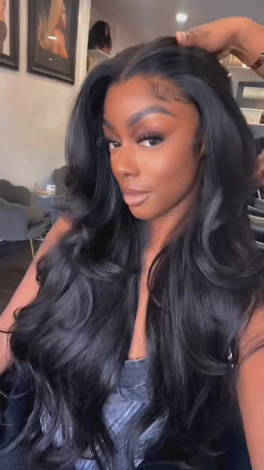 beautiful gorgeous woman in black long hair, she has a lace frontal sew in and she sits n a coffee shop showing off her long bouncy curls that look incredible